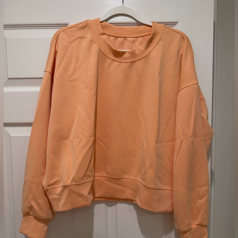 Lululemon light orange women’s softstreme crewneck size 10